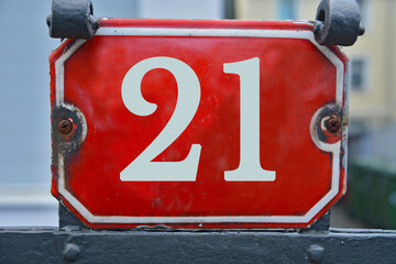 Wall Mural - A red number plaque, showing the number twenty-one, 21