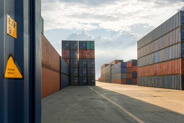 Wall Mural - Stack of containers in a harbor. Shipping containers stacked on cargo ship. Background of Stack of Containers at a Port.