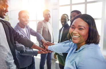 Wall Mural - young business woman and her colleagues are showing their unity .