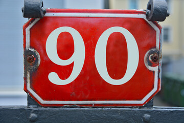 Wall Mural - A red number plaque, showing the number ninety, 90