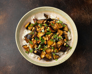 Wall Mural - Asian Eggplant with rice, peanuts and spring onion. Healthy food.
