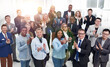 © ASDF - group of happy business people applauding together.