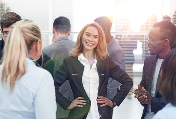 Wall Mural - Happy diverse professional business team stand in office looking at camera