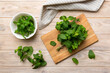 © sosiukin - Fresh mint on Cutting board table, top view. Flat lay Space for text