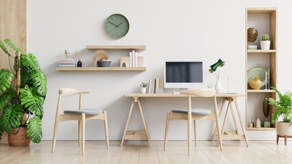 White office room with desktop computer on rack at white wall background.