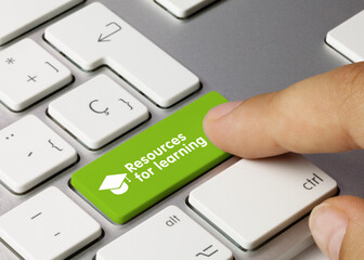 Resources for learning - Inscription on Green Keyboard Key.