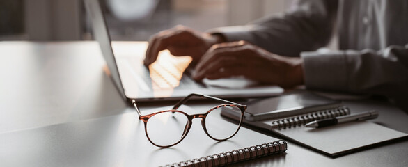 Man hands typing on computer keyboard closeup, businessman or student using laptop at home, panoramic banner, online learning, internet marketing, working from home, office workplace freelance concept