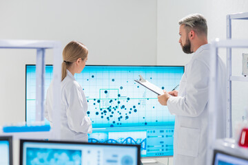 Wall Mural - professional team of scientists is working on a vaccine in a modern scientific research laboratory. 