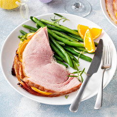 Wall Mural - Easter baked ham served on a plate with green beans