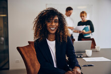 Businesswoman Smiling In An Office Meeting