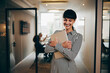 © Flamingo Images - Laughing businesswoman holding a laptop at work