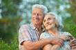 © aletia2011 - Beautiful senior couple hugging in the summer park