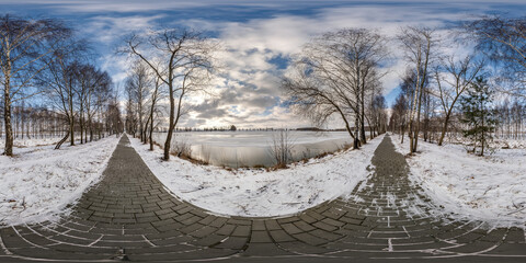 Wall Mural - winter full spherical hdr panorama 360 degrees angle view on pedestrian road near lake in a snowy birch alley in equirectangular projection. VR AR content