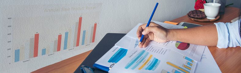 Banner Businesswoman reading financial graph charts business info with computer laptop. Panorama Women hands using laptop on office desk. Hands of business woman working office with copy space