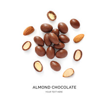 Creative Layout Made Of Almonds In Chocolate On The White Background. Flat Lay. Food Concept.