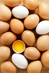 Wall Mural - Eggs with brown and white colors as background.