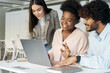 © Stock 4 You - Interracial student colleague diverse group working on laptop together