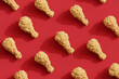 pattern fried chickens on red background. Food concept. 3d rendering