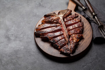 Wall Mural - Grilled porterhouse beef steak. Sliced T-bone