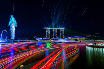 Wall Mural - City view at Singapore central area at night with Man shaped drone art.