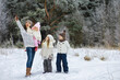 © alexkich - Happy family playing and laughing in winter outdoors in the snow. City park winter day.