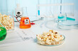 Pop corns in a petri dish. Pop corn control in toxic test lab. Photo of popcorn on the chemical laboratory table. Food quality and safety control of allergens. Chemical glassware, such as flasks