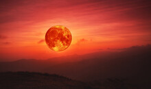 Blood Moon Concept Of A Red Full Moon In Red Sky With Cloud.