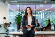 © Westend61 - Young manager with smart phone in office