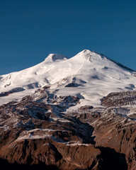 Wall Mural - Amazing snowy mountain landscape of the Caucasus, peaks of mount Elbrus on a clear blue sky day