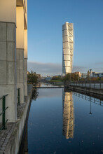 Sweden, Skane County, Malmo, Turning Torso Skyscraper Reflecting In Canal