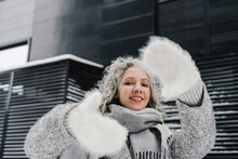 Smiling Woman Making Wearing Fur Gloves Making Finger Frame