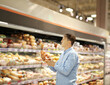 Senior Man Choosing groceries, vegetables, fruits in the supermarket