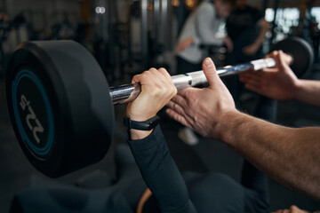 Female athlete doing lying bench press exercise