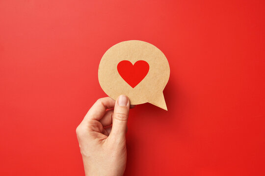 red paper heart on a conversational cloud. symbol of love and conversation and declaration of love