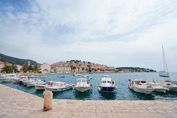 Wall Mural - Hvar Old Town Promenade. Sea coast in Dalmatia,Croatia. A famous tourist destination on the Adriatic sea. Old town and marina.