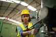 © FotoArtist - Female apprentice in metal working factory, Portrait of working female industry technical worker or engineer woman working in an industrial manufacturing factory company.
