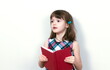© gmstockstudio - Little girl reading a book at home