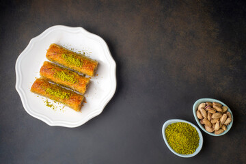 Turkish famous dessert burma kadayif on plate with pistachio