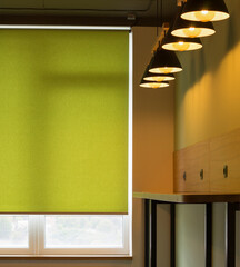 Poster - Roller blinds closeup on the window in the interior. Roller shades for big windows. Automated curtains for office. Green color, monochrome material. Window coverings.