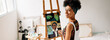 © (JLco) Julia Amaral - Confident female painter working in her studio