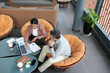 © DragonImages - Managers of marketing department discussing data in chart of visitors activity at meeting