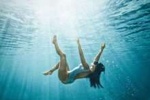 Italy, Sardinia, Woman Swimming In Sea