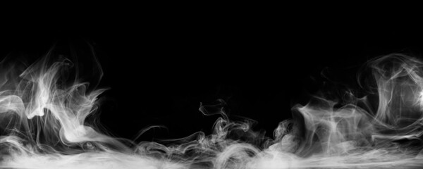 Panoramic view of the abstract fog. White cloudiness, mist or smog moves on black background. Beautiful swirling gray smoke. Mockup for your logo. Wide angle horizontal wallpaper or web banner.