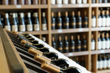 Wine bottles with blank labels on the counter of a liquor store. Wine background.