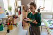 © Halfpoint - Happy little girl preparing for art and craft class indoors at school