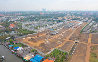 Aerial view of residential neighborhood with under construction site. Urban housing development from above. Top view. Real estate in urban city town. Property real estate.