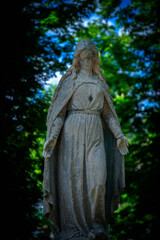 Fototapete - Virgin Mary ancient stone statue. Vintage sculpture of sad woman in grief