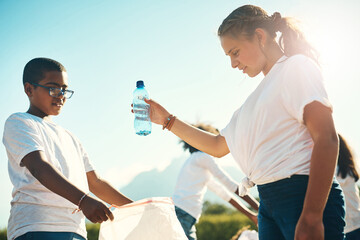 Canvas Print - Cleaning nature is healing nature. Shot of a group of teenagers picking up litter summer camp.