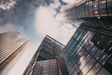 glass façade of tall skyscraper business buildings