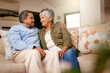 © Tasneem H/peopleimages.com - Happily retired ever after. Shot of a happy older couple relaxing on the sofa together at home.